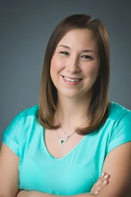 Professional headshot with natural expression