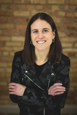 Joyful actor headshot with natural indoor backdrop
