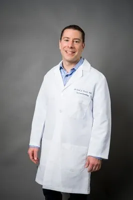 Doctor in white coat formal headshot