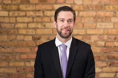 Professional headshot in indoor setting