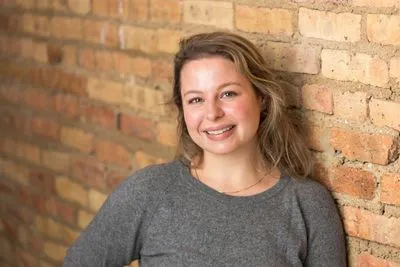 On-location headshot with natural indoor backdrop
