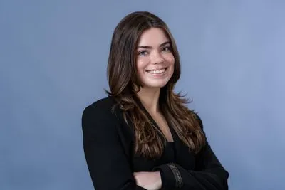 Teen actor headshot with blue backdrop